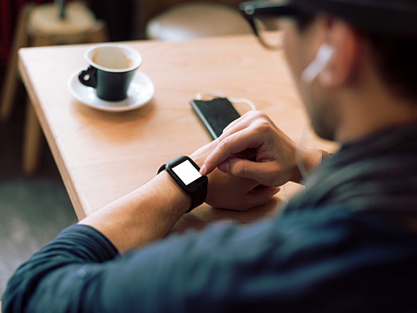 Man looking at wearable digital watch 